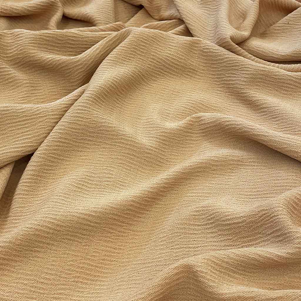 پارچه کریشه پفکی ساده رنگ شتری